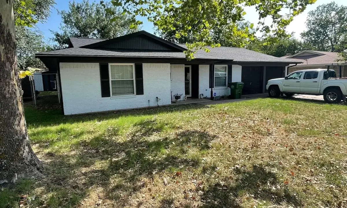 Professional roofing crew working on a residential roof in Taylorsville